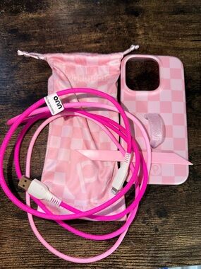 iPhone 14 Pro loopy case with extra loop and charging cable.